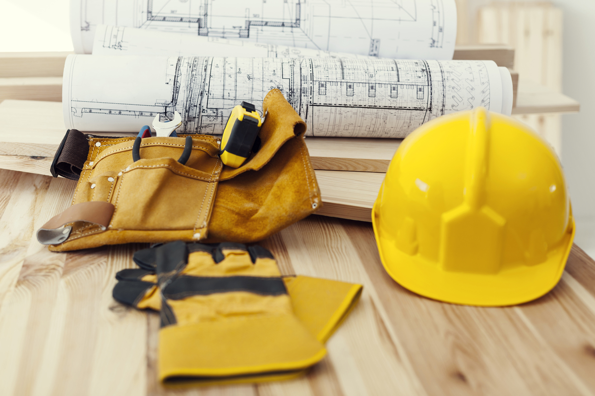 Commercial remodeling plans and construction tools in the table.