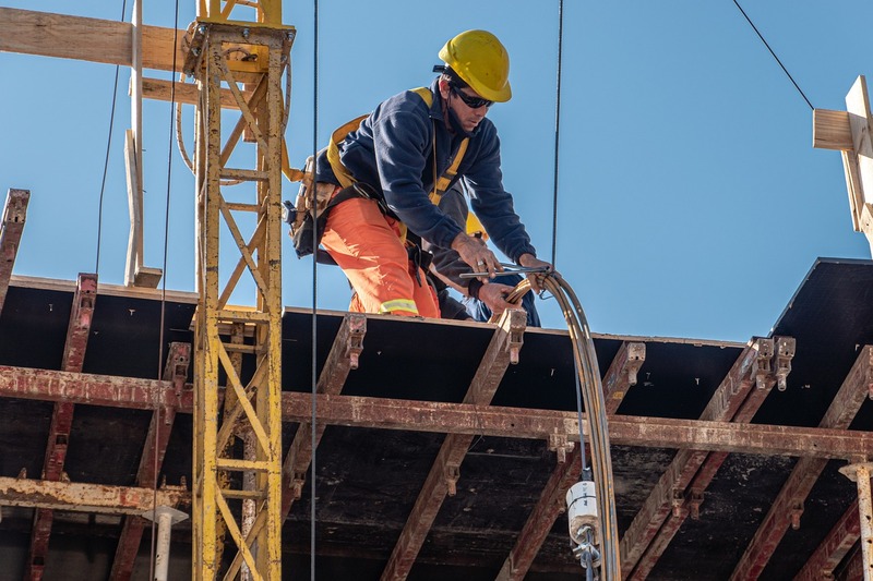 Expert builder working on a commercial building construction site.