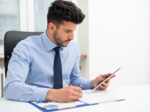 Man researching commercial building construction companies