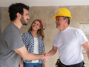 Couple collaborating closely with the contractor