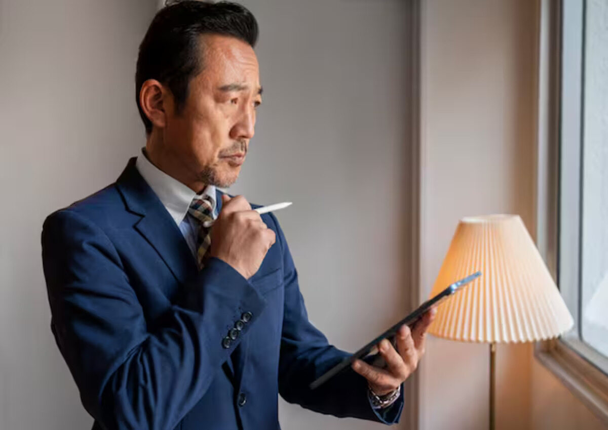 A businessman carefully evaluates contractors' qualifications