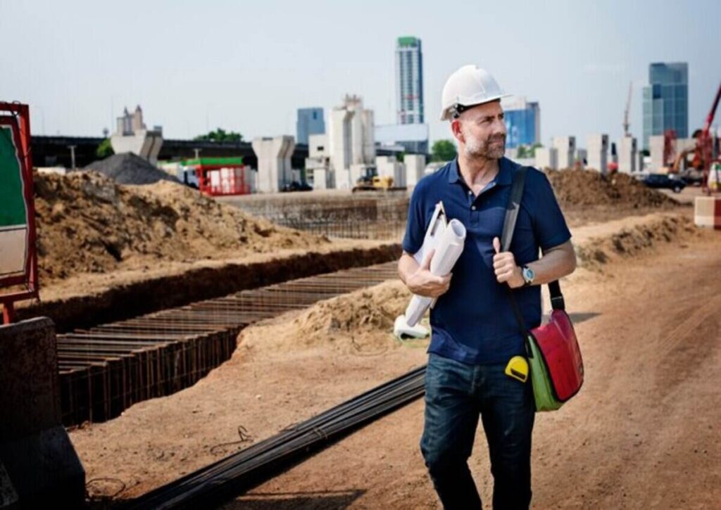 Contractors monitoring the ongoing commercial building construction