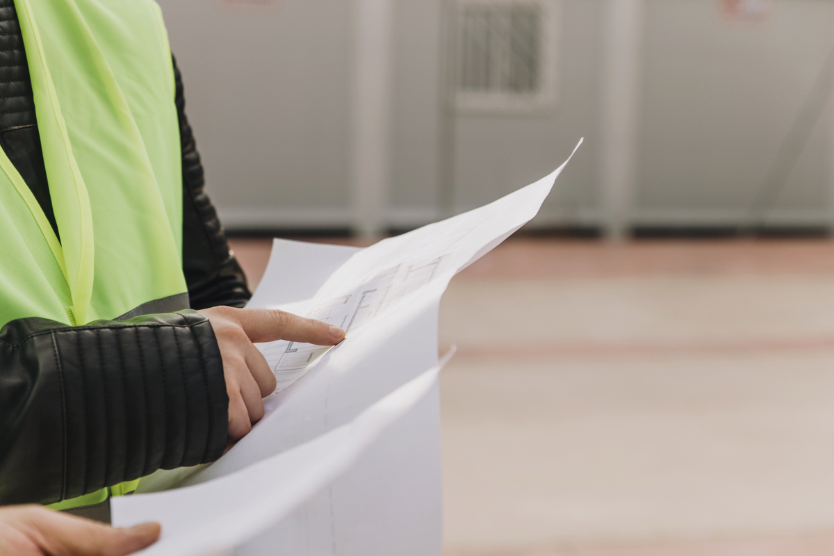 A man examining the commercial construction layout.