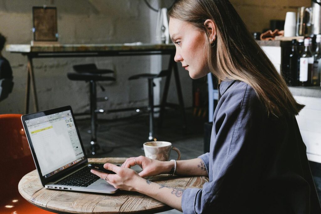 A woman using a laptop in a restaurant for remodeling