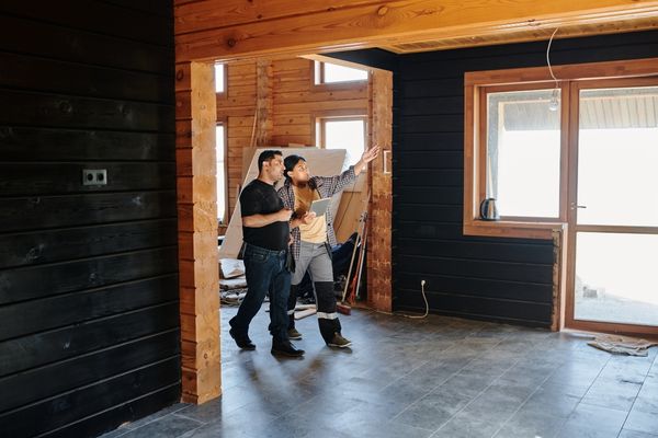 A worker discussing an obstacle affecting restaurant remodeling timeline