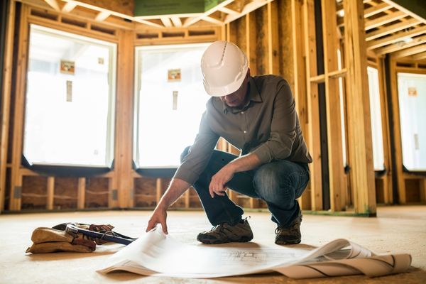 A restaurant contractor reviewing the construction plan