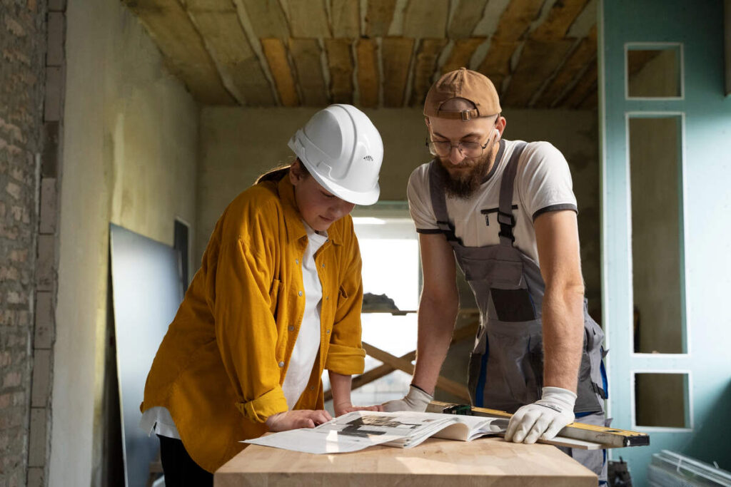 Professional discussing The Meaning Of Building Remodeling