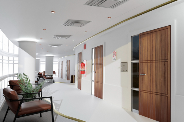 Modern medical office hallway with doors and seating area.