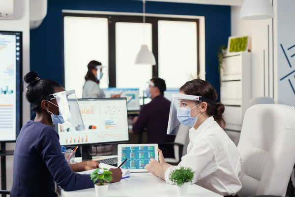 Healthcare team collaborating inside a modern medical office building.