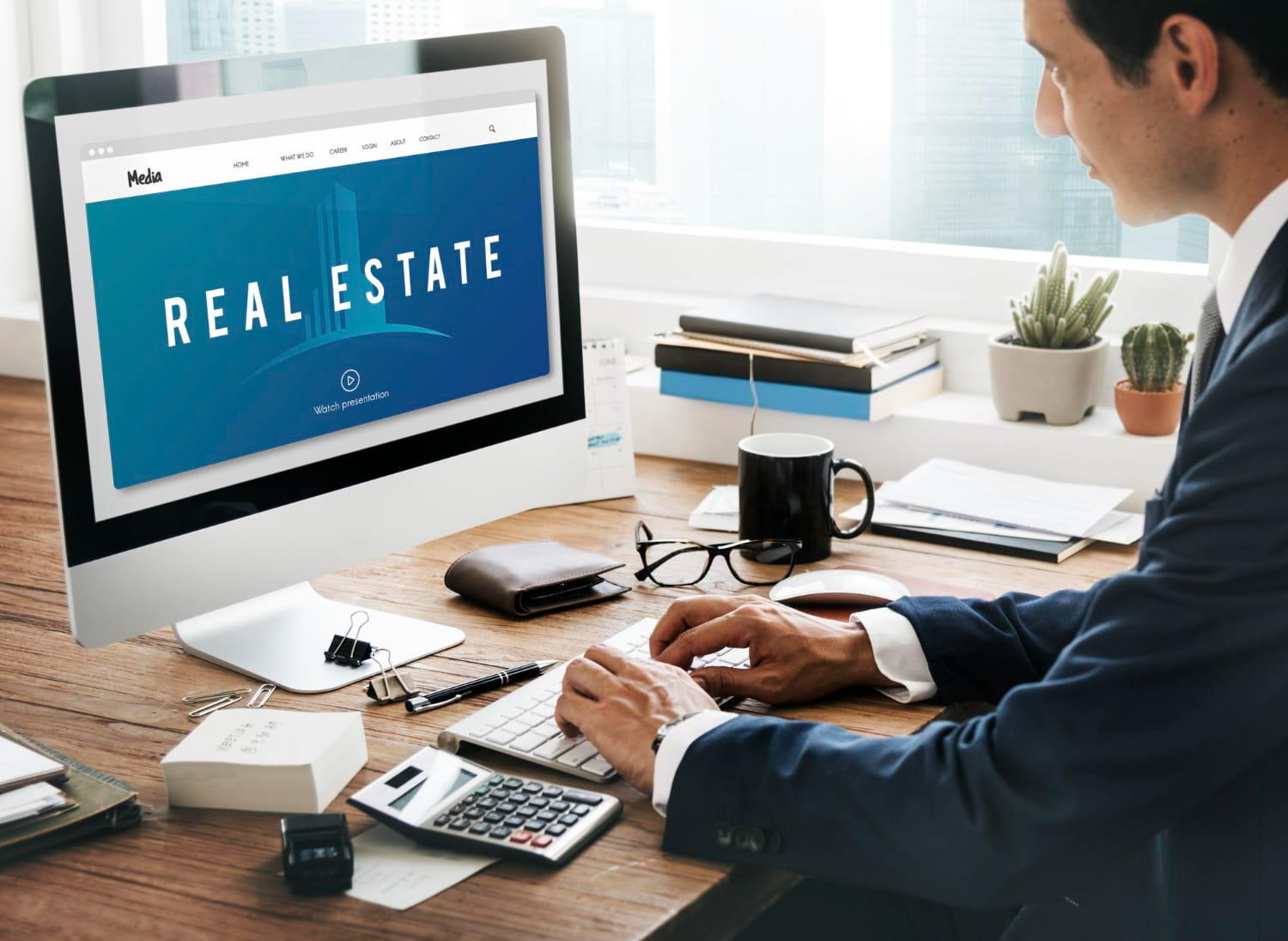 A Man Searching for Real Estate to Buy Online