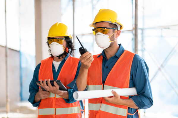 Engineers wearing PPE at a restaurant construction site