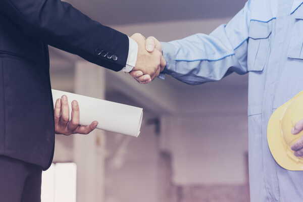 A handshake between the client and the restaurant builder